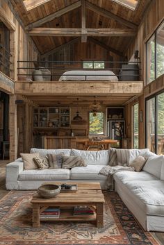 a living room filled with furniture and lots of windows