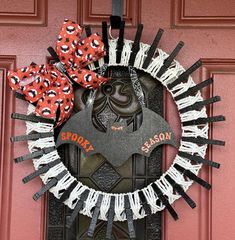 a decorated door hanger that says shorty and has red bows on it, with the word shorty written in black