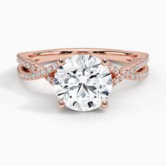 a rose gold engagement ring with an oval cut diamond surrounded by pave set diamonds