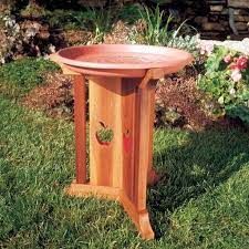 a wooden table sitting in the grass