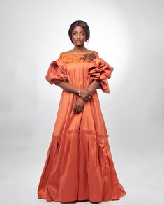 She’s a queen to be… Regal and elegant, this take on a traditional kaba is crafted in taffeta and embellished with a lace trim. The kaba is the traditional dress from the South-West and Littoral provinces of Cameroon, West Africa which has captured the imagination of international designers like Stella McCartney. Product Details Maxi ruffle Composition Taffeta Care Dry clean only Made in Cameroon, West Africa Taffeta Evening Dress, Floor-length, Evening Maxi Dress With Embroidered Sleeves, Traditional Silk Ruffle Dress, Traditional Silk Dress With Ruffles, Embellished Taffeta Dresses For Wedding, Party Dresses With Embroidered Sleeves In Organza, Elegant Organza Dress With Embroidered Sleeves, Silk Party Dress With Embroidered Sleeves, Fitted Silk Dresses With Embroidered Sleeves