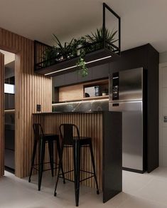 two bar stools in front of a counter with plants growing on the top shelf