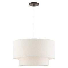 The meadow collection is both modern and versatile. The hand-crafted oatmeal colored fabric hardback shade is set off by the silky white fabric on the inside setting a pleasant mood. The three-light double drum shade adds character to this handsomely styled pendant. Perfect fit for the living room, dining room, kitchen and bedroom. This sleek design is shown in an English bronze finish. Livex Lighting Meadow 3-Light English Bronze Transitional Drum Medium Hanging Pendant Light Rubber | 49803-92 Minimal Pendant, Drum Pendant Lighting, H Design, Transitional Pendant Lighting, Colored Fabric, Kitchens And Bedrooms, 3 Light Pendant, Drum Chandelier, Drum Pendant