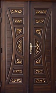 two wooden doors with decorative designs on them