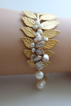 Gold Leaf Bracelet, Leaf Wedding Bracelet , Pearl Cuff bracelet, Pearl Bracelet, Leaf Branch Bracelet.  via Etsy. Handmade Gold Pearl Bracelet For Wedding, Gold Metal Pearl Bracelet For Weddings, Gold Wire Wrapped Pearl Bracelet For Weddings, Jewellery Tutorial, Art Deco Headpiece, Branch Bracelet, Diy Floral Wreath, Silver Leaf Bracelet, Pearl Bracelet Wedding