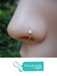 an image of a nose with a diamond ring on it's side and the words handmade at amazon below