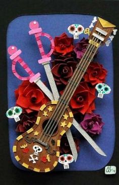 a guitar and some roses on a blue plate with the word love spelled in it