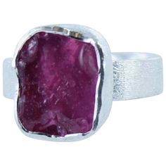 The Sterling Silver and Rough Ruby Ring is a beautiful rough cut piece of vibrant ruby set in a gorgeous sterling silver ring with a contemporary matt finish to the setting and band. This stunning ring is cleverly designed so it can gently adjust.  The combination of the eye popping colour with the contemporary design makes for a very special piece that will be admired by all. Silver does tarnish over time when the surface of the silver reacts with oxygen to create silver oxide which is grey/bla Cleaning Tarnished Silver, Ruby Set, Bracelet Pendant, August Birthstone Jewelry, July Birthstone Jewelry, Gifts For New Mums, Matching Bracelet, Exclusive Jewelry, Pearl Jewellery Earrings