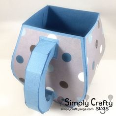 a blue and white bag with polka dots on it