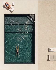 an aerial view of a person swimming in the water