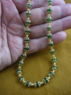 (Internal #V-308-14-20) You are bidding on a beautiful, handmade, necklace made with Jade round bead 6 mm, gold plated 4 mm bead spacers and gold filigree caps. Necklace is 20" long, with gold safety closure. * Want something longer, special order is $4.00 per inch.WE SHIP WORLDWIDE! Other accepted payment: Credit card (Mastercard/Visa/Discover) inquire for details. Festive 8mm Round Bead Necklace, Traditional Gold Beaded Necklaces With 8mm Beads, Gold Beaded Necklaces For Jewelry Making (8mm Beads), Gold Spiritual Necklace With Spacer Beads, Spiritual Gold Necklace With Spacer Beads, Gold Necklaces With Large Round Beads, Yellow Gold Beaded Necklace With 8mm Round Beads, Gold Round Beaded Necklaces, Spiritual Gold Beaded Necklaces