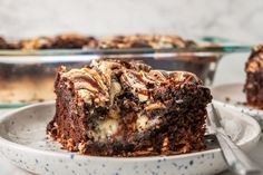 a piece of chocolate cake on a plate with a fork