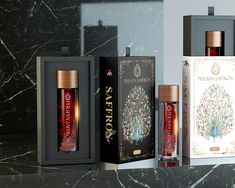 three different types of perfumes in boxes on a counter