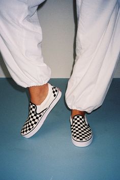 You'll reach for the Vans Classic Black & White Checkerboard Slip-On Sneakers time and time again when you want to create casually cool looks! These timeless sneakers have a sturdy canvas construction that creates a sleek silhouette with a rounded toe upper, elastic gussets at the sides, and a low-cut, padded collar. The effortless slip-on design makes these shoes essential when you have places to go and things to do! Logo tag at the outstep and heel. Iconic black & white checker design. 1" rubber sole. Lightly cushioned insole. Rubber sole has nonskid markings. Man made materials. Imported. Lulus | Classic Black & White Checkerboard Slip-On Sneakers | Size 7.5. Checkered Vans Platform, Black Checkered Vans, Vans Classic Black, Vans Shoes Checkerboard, Checkerboard Vans, Checkered Shoes, Vans Checkerboard Slip On, Checkered Vans, Checker Design