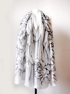 Angel Wings silk scarf is a big scarf, a pareo or a sarong (beach wrap) made of natural silk by the process of hand drawing. This silk scarf XL is decorated with a design of feathers arranged in a shape of wings with flowers. This XL scarves is made of natural silk type Habotai Medium, which is almost non transparent, glossy and rich. It will require gentle hand - washing and ironing on the lowest temperature set. This Wings scarf was originally drawn for a lovely lady, who asked me for the bigg Wing Scarf, Scarf Black And White, Feather Scarf, Pareo Sarong, Black And White Scarf, Big Scarf, Who Asked, White Scarf, Bird Wings