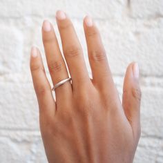 The Silver Crescent Moonface Ring from Anthony Lent has a sparkly white diamond eye. His realistic face and dreamy matte silver finish point to Anthony's fascination with Renaissance astronomy and how art and science combine. This piece looks especially great layered with other celestial rings. Stone: White Diamonds, Total .02tcwMetal: Sterling SilverMeasurements: Moon length: 13mm, Moon height: 5mm, Band width: 2mm Shipping and Delivery: IN STOCK items will ship within 2 business days Sizes not Minimalist Silver Rings With Single Cut Diamonds, Minimalist Silver Stackable Rings With Tension Setting, Modern White Gold Diamond Ring With Si Clarity, Silver Minimalist Diamond Ring, Minimalist Silver Diamond Ring With Polished Finish, Minimalist Silver Diamond Ring, Minimalist Silver Diamond Ring With Single Cut Diamonds, Minimalist Platinum Diamond Ring, Minimalist Silver Diamond Ring With Tension Setting