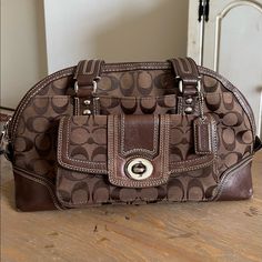 - Signature Brown Leather - Double Handle - Used Condition. Some Wear Of Leather On Corners, Inside Could Use More Cleaning - Flaws Pictured - Turn Clasp On Front Pocket - Very Stylish And Trendy Right Now! Brown Coach Bag With Double Handle, Brown Coach Shoulder Bag With Branded Hardware, Brown/black Coach Bag, Coach Shoulder Bag With Gold-tone Hardware And Double Handle, Brown Coach Bag With Turn-lock Closure, Bags Coach, Satchel Bag, Coach Bags, Satchel Bags