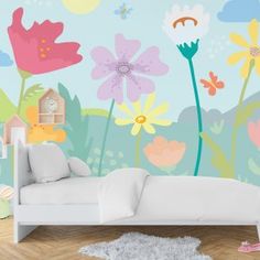 a child's bedroom with flowers and butterflies painted on the wall