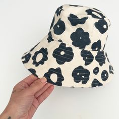 Perfect for a day of fun in the sun, our bucket hat is structured with an extra-wide brim to keep you cool and covered on the go. 100% cotton canvas screen printed with water-based inks Made in California Brim: 3.5" Circumference: 23" To clean: spot clean and/or dry clean. Jenny Pennywood, Black Bucket Hat, Black Bucket, Fun In The Sun, Keep Your Cool, Wide Brimmed, Water Based Ink, The Go, Bucket Hat