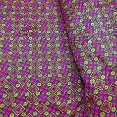 an image of a colorful cloth with flowers on the back and bottom side, as if it were made out of fabric