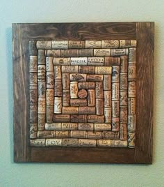 a wooden frame with wine corks on it