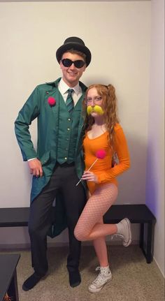 a man and woman dressed up in costumes