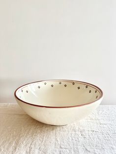 a white bowl sitting on top of a table