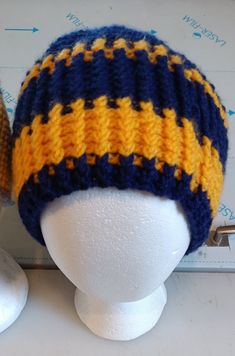 Adult size hat - hand crochet by me. West Virginia University colors Handmade Yellow Crochet Hat For Winter, Yellow Yarn Crochet Cap, Yellow Crochet Cap Hat, Yellow Crochet Yarn Cap, Handmade Yellow Crochet Hat, Yellow Hand Knitted Beanie Crochet Hat, Yellow Yarn Crochet Hat, Yellow Yarn Crochet Beanie Hat, Hand Knitted Yellow Crochet Hat One Size