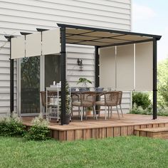 an outdoor patio with table and chairs on it