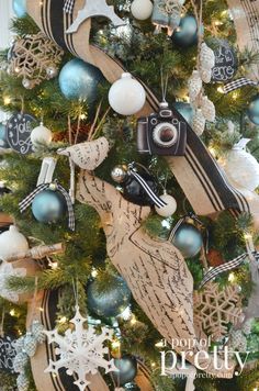 a christmas tree decorated with blue and white ornaments