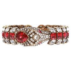 Gold-tone bracelet with a snake motif from Gucci. Encrusted with decorative elements in silver-tone and red. Structured design Gold-tone metal and crystal embellishments. Composition: Crystal, Metal Width: 0.8" Designer Style ID: 596004I4769 Made in Italy Gucci Snake, Snake Motif, Gucci Inspired, Modern Bracelets, Zero Tolerance, A Snake, Decorative Elements, Crystal Embellishment, Bracelet Gold