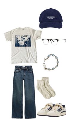 the smiths t - shirt, jeans, and hat are arranged on top of each other