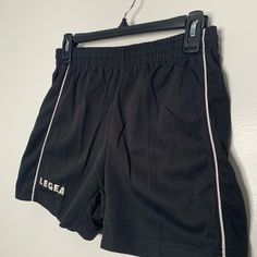 Small black and white vintage athletic shorts uniform set. Excellent condition, never worn. Labeled size XS, fits true to size with stretchTopShoulder 17"Chest 17"Length 28"Sleeve 9.5"BottomWaist 13" across w/stretchInseam 3"Length 13.5" Casual Athletic Shorts For Cheerleading, Casual Cheerleading Shorts, Casual Shorts For Cheerleading, Black Cheerleading Shorts, Black Cheerleading Bottoms Short Length, Black Sporty Bottoms For Cheerleading, Sporty Black Bottoms For Cheerleading, Casual Shorts For Cheerleading During Sports Season, Moisture-wicking Sportswear Shorts For Cheerleading