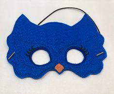 "Blue Owl Masks. Great for dramatic play/dress-up. Fun mask for Halloween or Cos Play. These masks would make a fun party favor or fun addition to a themed birthday party. Need a larger quantity than what I have listed? Message me. I can usually accommodate larger orders. These masks are made from felt. The details are machine embroidered. The masks include a 13\" elastic strap. This size typically fits from age 3 to small adult. This mask measures approximately 7 by 5 inches. These items can be Blue Masks For Carnival Costume Party, Blue Superhero Costume For Costume Party, Themed Halloween Costume Party Supplies, Fun Party Masks For Carnival, Blue Costume Accessories For Carnival, Blue Costume Accessories For Carnival Party, Fun Halloween Masquerade Costume Accessories, Blue Carnival Costume Accessories, Fun Carnival Party Masks