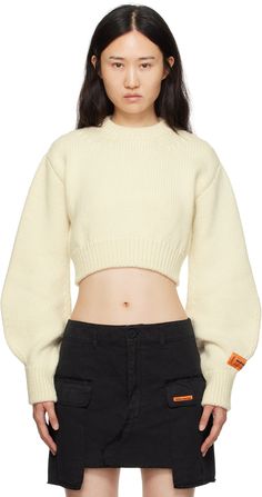 Knit wool sweater. · Rib knit crewneck, hem, and cuffs · Cropped hem · Bishop sleeves · Logo patch at sleeve · Cutout at back Supplier color: White Sleeve Crop Sweater, White Cropped Sweater, Sweater Jumper, Heron Preston, Knit Crewneck, Yellow Fashion, White Crop, Knit Jumper, White Sweaters