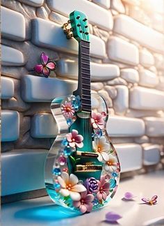 a green guitar sitting on top of a table next to a brick wall with flowers