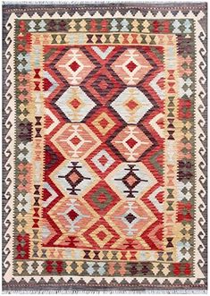 an orange, red and green rug with diamond shapes on the bottom half of it