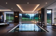 an indoor swimming pool in a modern home