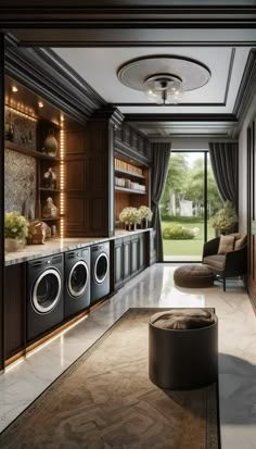 a modern laundry room with washers and dryer