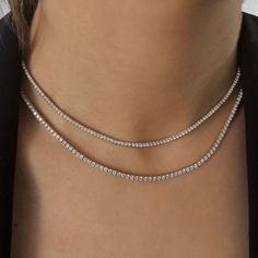 Indulge in luxury with our 3.50 Carats Diamond Tennis Necklace. Crafted in 14k or 18k gold, this necklace features radiant lab-grown diamonds that mimic their natural counterparts while prioritizing sustainability. Its timeless design makes it perfect for everyday wear or special occasions. Surprise your loved one with this exquisite gift and witness their radiant smile.𝐅𝐞𝐚𝐭𝐮𝐫𝐞𝐬:• 𝐌𝐚𝐝𝐞 𝐭𝐨 𝐎𝐫𝐝𝐞𝐫• 𝐌𝐞𝐭𝐚𝐥: 𝟏𝟒𝐊 𝐆𝐨𝐥𝐝 | 𝟏𝟖𝐊 𝐆𝐨𝐥𝐝• 𝐁𝐚𝐧𝐝 𝐂𝐨𝐥𝐨𝐫𝐬: Rose Gold, Yellow Gold & White Gold• 𝐖𝐢𝐝𝐭𝐡: 1.70 MM𝐂𝐞𝐧𝐭𝐞𝐫 𝐬𝐭𝐨𝐧𝐞:• 𝐒𝐭𝐨𝐧𝐞 - Lab Grown Diamond• 𝐒𝐡𝐚𝐩𝐞 - Brilliant Cut Round• 𝐃𝐢𝐚𝐦𝐨𝐧𝐝 𝐒𝐢𝐳𝐞 - 1.70 MM• 𝐂𝐚𝐫𝐚𝐭 𝐖𝐞𝐢𝐠𝐡𝐭 - 3.50 Carats (𝐅𝐨𝐫 𝟏𝟔 𝐈𝐧𝐜𝐡)• 𝐂𝐨𝐥𝐨𝐫 - D-E-F• 𝐂𝐥𝐚𝐫𝐢𝐭𝐲 - VS𝐓𝐡𝐞 𝐜𝐚𝐫𝐚𝐭 𝐰𝐞𝐢𝐠𝐡 Elegant Moissanite Necklaces With Vvs Clarity, Dazzling Necklace With Diamond Accents And Lab-grown Diamonds, Dazzling Necklace With Lab Grown Diamond Accents, Dazzling Necklace With Lab-grown Diamond Accents, Gift Tennis Necklace With Diamond Accents, Luxury Diamond White Necklace With Clavicle Chain, Diamond White Moissanite Necklace With 17 Jewels, Diamond White Tennis Necklace With Clavicle Chain, Luxury Necklace With Diamond Accents And Lab Grown Diamonds