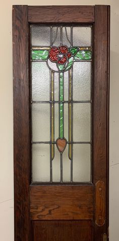 a wooden door with stained glass on it