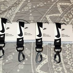 Stylish Key Holder In Black And White. Nike Lanyard, Jordan White, Purple Nikes, Wrist Lanyard, Nike Gold, Nike Accessories, Red Nike, Pink Nikes, Grey Nikes