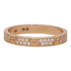 A vintage Cartier diamond mini Love ring set in 18k rose gold. The Love collection is a firm favourite of many mainly due to the simple yet beautiful design. This particular love ring is from the Love ring collection and is the small model. It is composed of a 2.6-millimetre band with eight individual nail motifs engraved around the band. Between each nail motif are two row of pave set diamonds adding the perfect sparkle to the piece. The ring can easily be worn for every day as a standalone pie Cartier Diamond, Cartier Love Ring, Mini Love, Cartier Jewelry, Ring Collection, Cartier Love, Love Vintage, Eternity Ring Diamond, Diamond Eternity