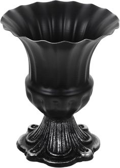 a black vase sitting on top of a metal stand