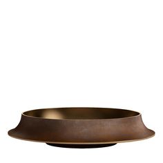 a large metal bowl sitting on top of a table