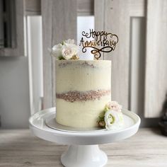 a white cake sitting on top of a wooden table