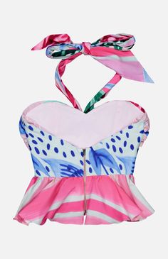 This cotton halter is a stunner. There’s a flattering peplum hem and ribbon straps along with a tropical pattern in a multicolored pink hue. An easy yet bold piece to add to your look, this tank top can be styled with everything from casual white denim to mini skirts. Make sure you pack it when heading off on vacation. 98% Cotton, 2% Elastane Sleeveless Halter top Exposed back zip Hand wash Made in Brazil Tropical Summer Halter Neck Top, Tropical Halter Neck Top For Summer, Tropical Print Sleeveless Halter Top For Beach, Sleeveless Tropical Print Halter Top For Beach, Tropical Halter Top For Summer, Tropical Sleeveless Halter Top For Summer, Pink Halter Neck Tank Top For Summer, Tropical Print Sleeveless Halter Top, Sleeveless Tropical Print Halter Top For Vacation