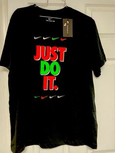 New Mens unisex Nike Black “Just Do It”  Standard Fit all Cotton S/S Tee Shirt  Multiple Sizes until sold, NWT  Machine wash.  From a nonsmoking environment. We ship globally.  No returns. Nike Black Cotton T-shirt, Nike Cotton Shirt With Letter Print, Nike Cotton Top, Nike Cotton Tops With Branding, Nike Black Cotton Tops, Black Nike Cotton Top, Black Cotton Nike Tops, Nike Tees, Nike Black