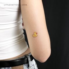 a woman with a rubber ducky tattoo on her arm