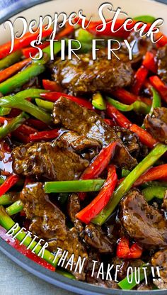 a bowl filled with beef and peppers on top of a table